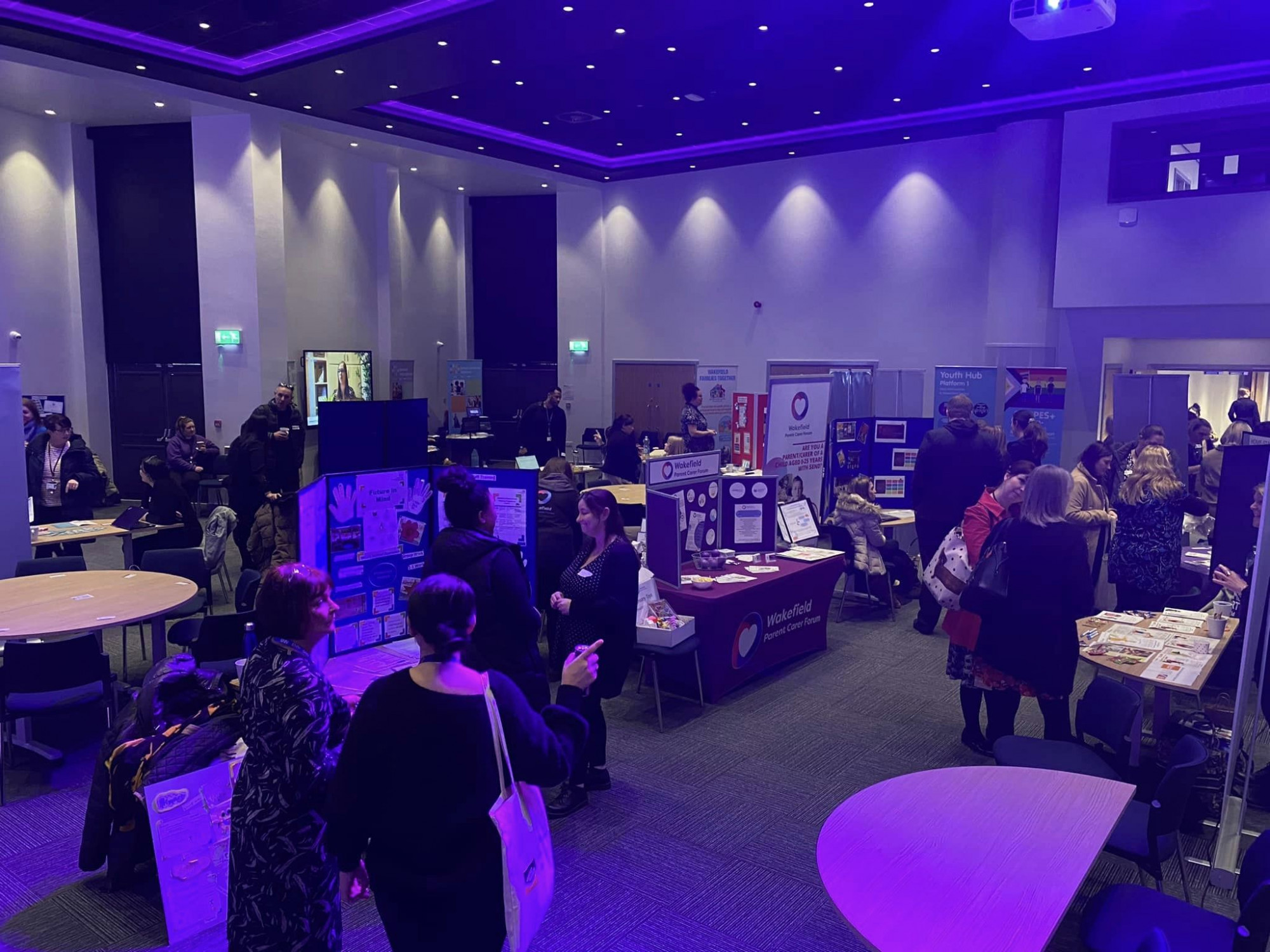 Photo showa stalls attending the reconnecting event and people stood talking